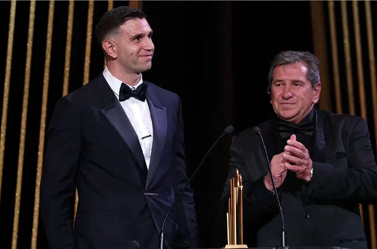 Martinez’s father joins him on the stage during the award ceremony