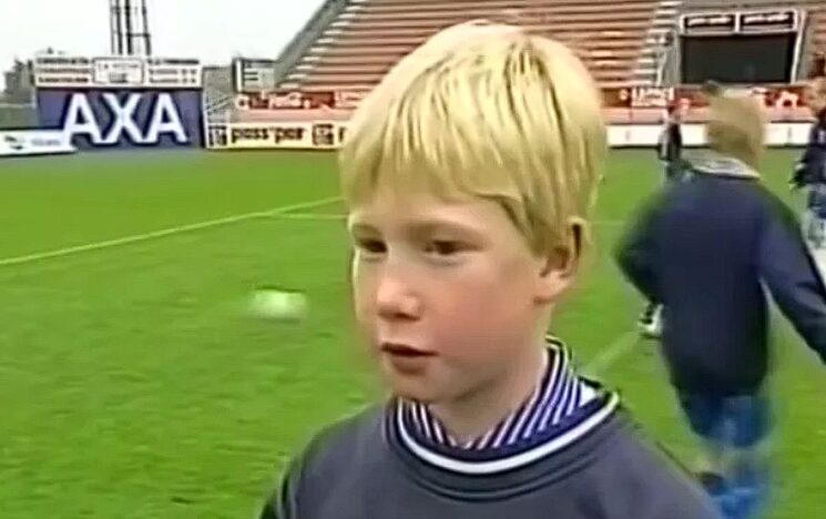 Young Kevin in the football stadium.