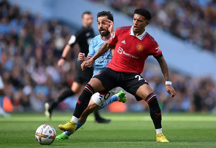 Jadon Sancho playing football for Manchester United.