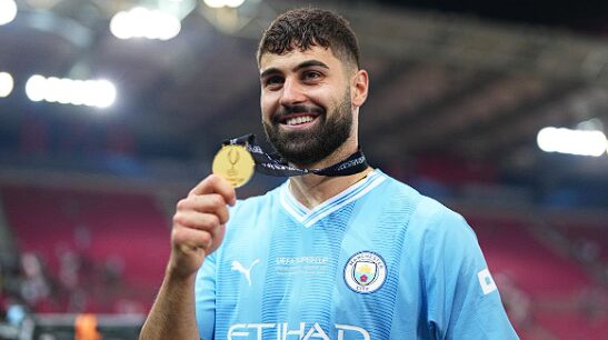 Josko Gvardiol takes a picture after winning the UEFA Super Cup 2023 match between Manchester City and Sevilla FC.